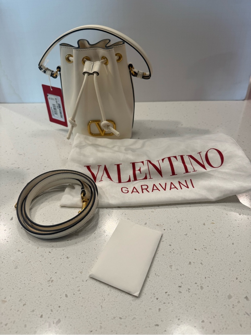 NWT & BOX Valentino Garavani Cream Leather VLogo Mini Drawstring Bag - Picture 14 of 15